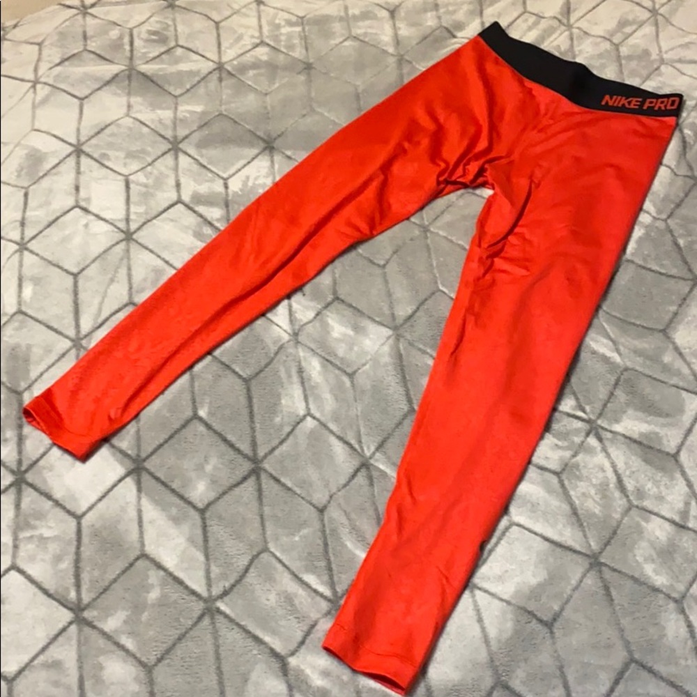 Red snakeskin Nike leggings